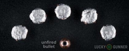 View from up above of fired Hornady 10mm Auto bullets compared to an unfired round
