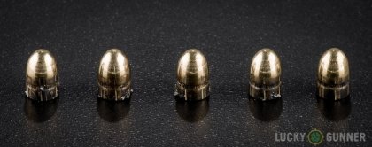 View from up above of fired Fiocchi .32 Auto (ACP) bullets compared to an unfired round