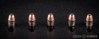 View from up above of fired CCI .22 Long Rifle (LR) bullets compared to an unfired round