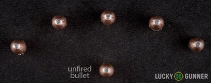 View from up above of fired Fiocchi .22 Magnum (WMR) bullets compared to an unfired round
