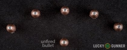 Image displaying fired .22 Magnum (WMR) rounds compared to an unfired bullet