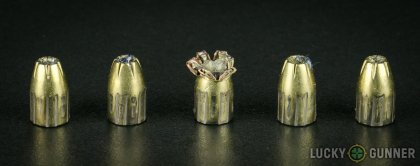 Side by side comparison of an unfired Magtech 9mm Luger (9x19) bullet vs. the unfired round