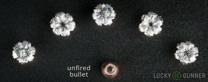 View from up above of fired Speer 9mm Luger (9x19) bullets compared to an unfired round