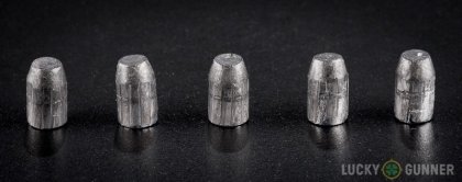 View from up above of fired Federal .32 H&R Magnum bullets compared to an unfired round