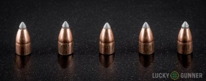 Side by side comparison of an unfired Winchester .22 Magnum (WMR) bullet vs. the unfired round
