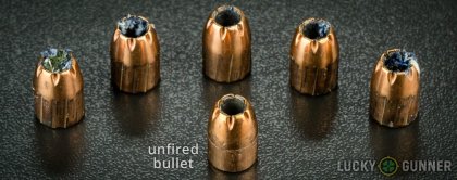 Side by side comparison of an unfired Remington .45 ACP (Auto) bullet vs. the unfired round