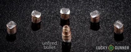 Image displaying fired .22 Long Rifle (LR) rounds compared to an unfired bullet