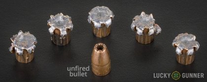 View from up above of fired Winchester 9mm Luger (9x19) bullets compared to an unfired round