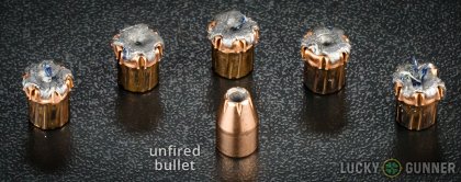 View from up above of fired Hornady 9mm Luger (9x19) bullets compared to an unfired round