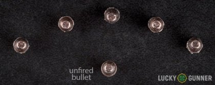 View from up above of fired Aguila .22 Long Rifle (LR) bullets compared to an unfired round