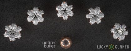 View from up above of fired Speer 9mm Luger (9x19) bullets compared to an unfired round