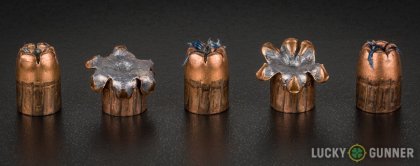 Side by side comparison of an unfired Winchester .45 ACP (Auto) bullet vs. the unfired round
