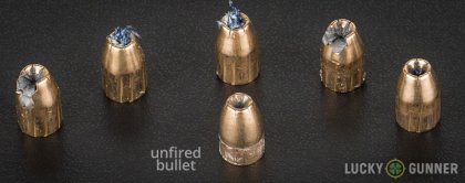 View from up above of fired Magtech 9mm Luger (9x19) bullets compared to an unfired round