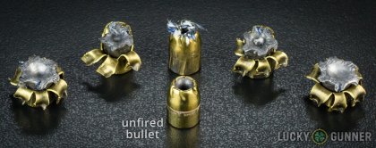 View from up above of fired Remington .40 S&W (Smith & Wesson) bullets compared to an unfired round