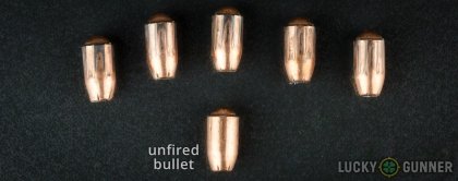 Side by side comparison of an unfired Remington 9mm Luger (9x19) bullet vs. the unfired round