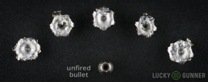 Image displaying fired 10mm Auto rounds compared to an unfired bullet