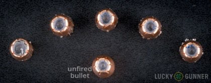 Image displaying fired .38 Special rounds compared to an unfired bullet