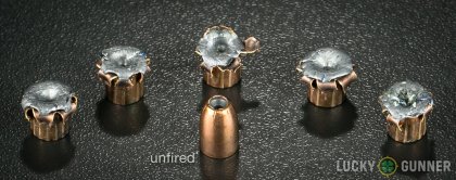 View from up above of fired Remington 9mm Luger (9x19) bullets compared to an unfired round