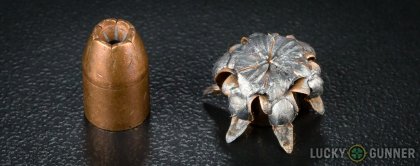 View from up above of fired Winchester .40 S&W (Smith & Wesson) bullets compared to an unfired round