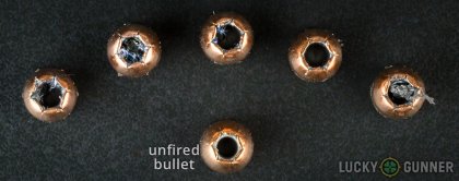 View from up above of fired Remington .45 ACP (Auto) bullets compared to an unfired round