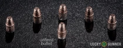 View from up above of fired Aguila .22 Long Rifle (LR) bullets compared to an unfired round