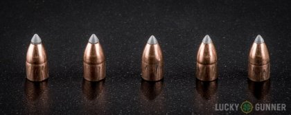 Side by side comparison of an unfired Winchester .22 Magnum (WMR) bullet vs. the unfired round