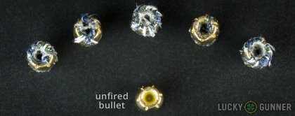 View from up above of fired Magtech .40 S&W (Smith & Wesson) bullets compared to an unfired round