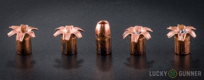 View from up above of fired Buffalo Bore .357 Magnum bullets compared to an unfired round