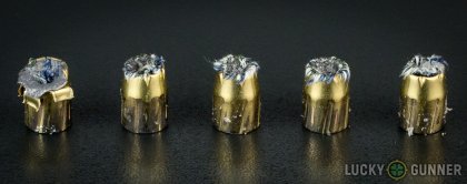 View from up above of fired Magtech .40 S&W (Smith & Wesson) bullets compared to an unfired round