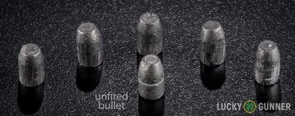 Side by side comparison of an unfired Federal .32 H&R Magnum bullet vs. the unfired round